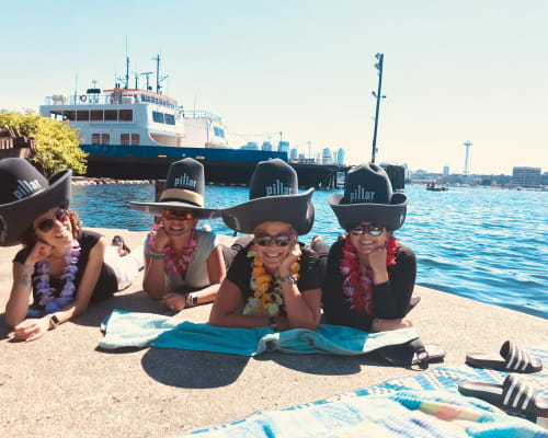 Employees dressed up by the waterfront near Pillar Properties in Seattle, Washington
