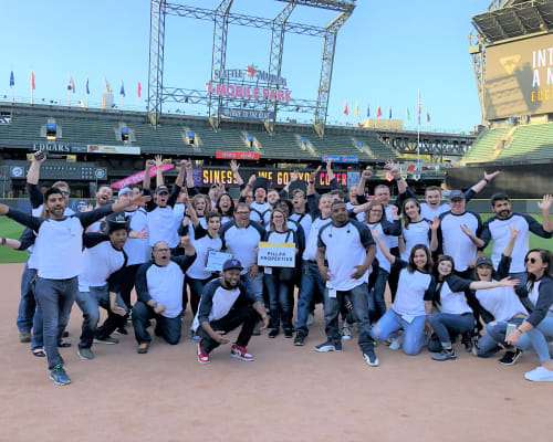 Employees at a baseball field near Pillar Properties in Seattle, Washington
