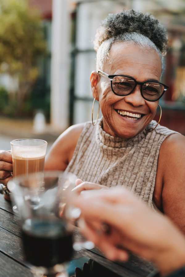 Residents enjoying coffee together at Merrill Gardens in Seattle, Washington
