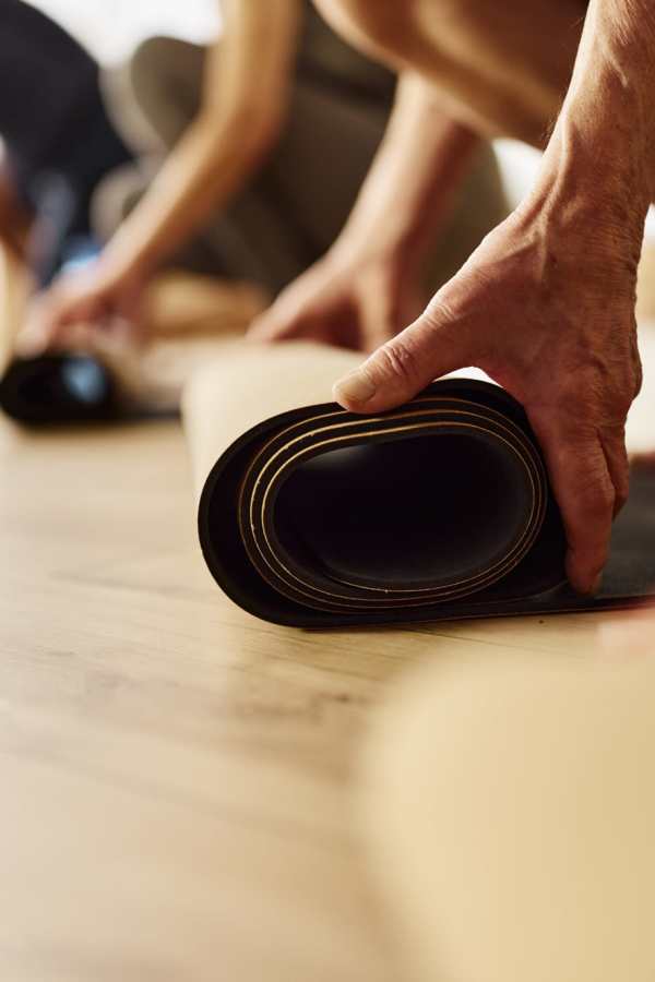 Residents unrolling yoga mats at Merrill Gardens at Renton Centre in Renton, Washington
