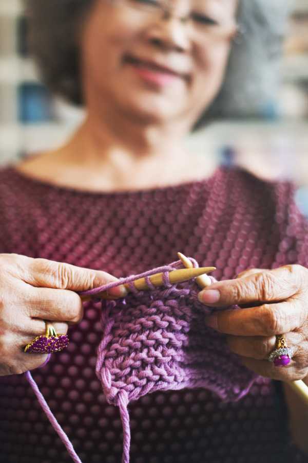 Resident crocheting at Merrill Gardens at Ballard in Seattle, Washington